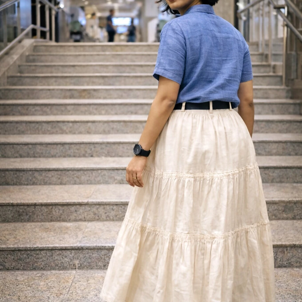 FEMME - Cream Solid Maxi Skirt with slip-on closure, featuring a flared hem.