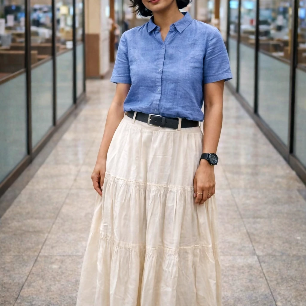 FEMME - Cream Solid Maxi Skirt with slip-on closure, featuring a flared hem.